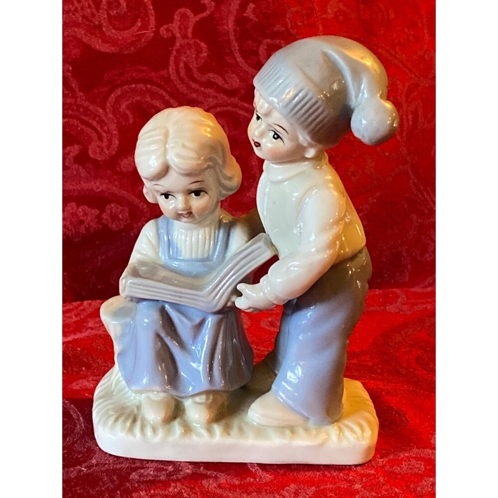 Leyo 1980 Ceramic boy and girl reading book on bench figurine